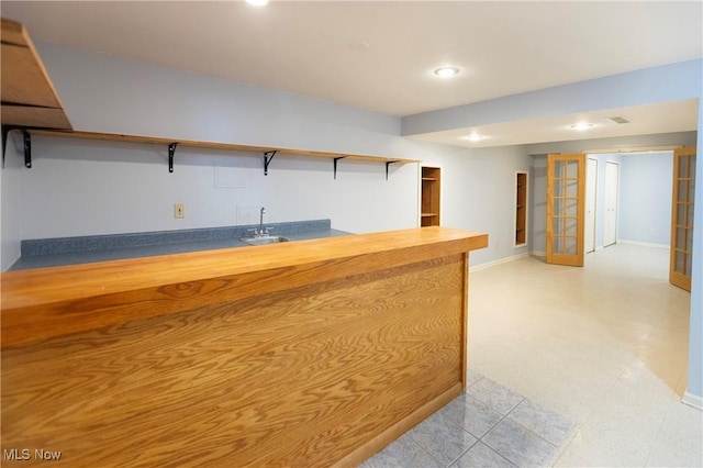 reception with indoor wet bar and visible vents