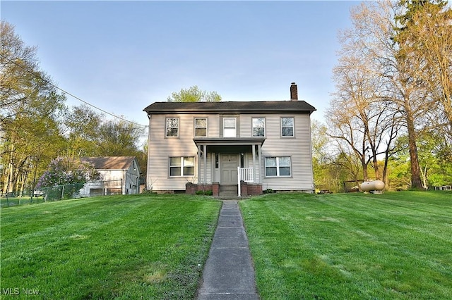 11680 Walnut Ave NE, Alliance, OH 44601 - view of front of home featuring a front lawn and a chimney