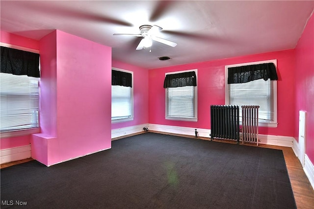 11680 Walnut Ave NE, Alliance, OH 44601 - unfurnished room with a ceiling fan, baseboards, and radiator heating unit