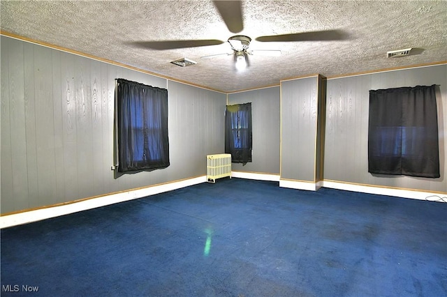 11680 Walnut Ave NE, Alliance, OH 44601 - spare room with ceiling fan, visible vents, baseboards, carpet floors, and ornamental molding
