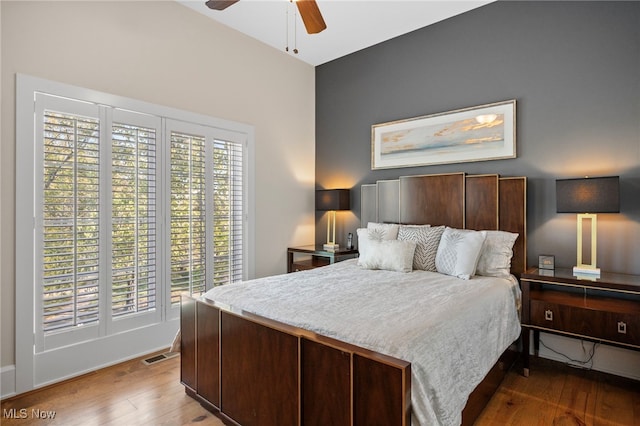bedroom featuring a ceiling fan, hardwood / wood-style flooring, and visible vents