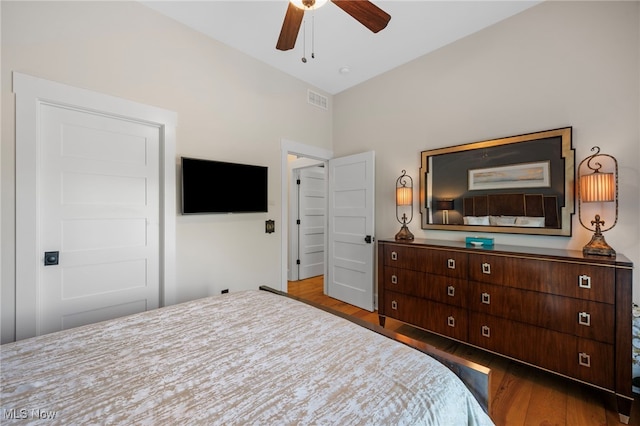 bedroom with visible vents, ceiling fan, and wood finished floors