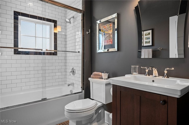 full bath featuring vanity, toilet, and shower / washtub combination