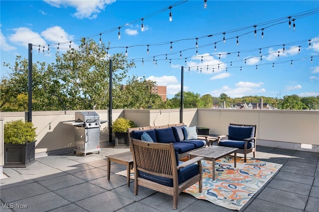 view of patio / terrace featuring outdoor lounge area, fence, and area for grilling