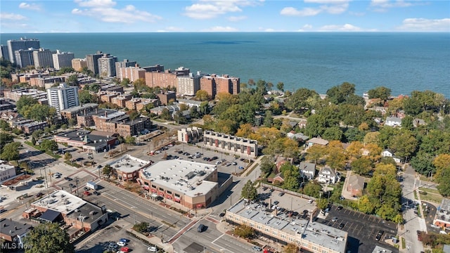 birds eye view of property featuring a view of city and a water view