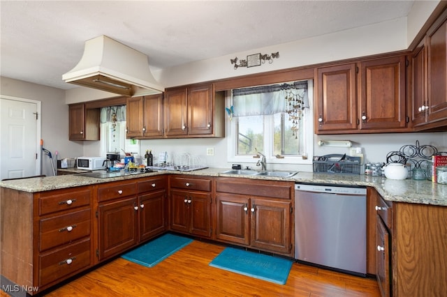 4299 Weymouth Rd, Medina, OH 44256 - kitchen with stainless steel dishwasher, a sink, light wood finished floors, and white microwave