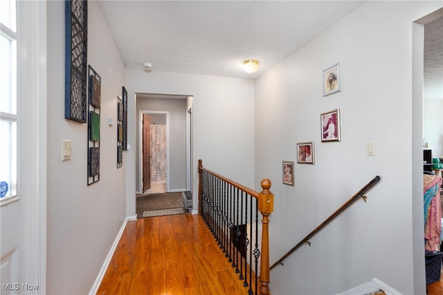 4299 Weymouth Rd, Medina, OH 44256 - corridor featuring baseboards, an upstairs landing, and wood finished floors