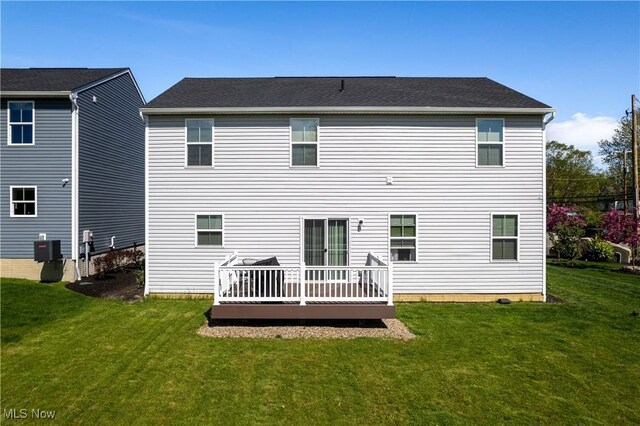 3939 Higgins Dr, Norton, OH 44203 - back of property with a wooden deck, a yard, and cooling unit