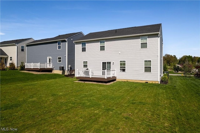 3939 Higgins Dr, Norton, OH 44203 - back of house with a lawn, a wooden deck, and cooling unit