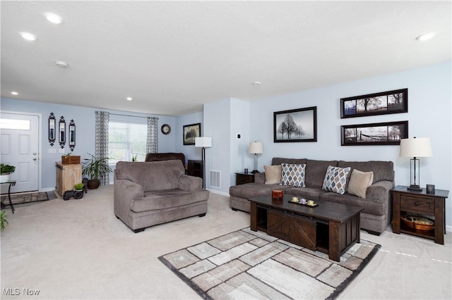 3939 Higgins Dr, Norton, OH 44203 - living room featuring baseboards, carpet flooring, recessed lighting, and visible vents