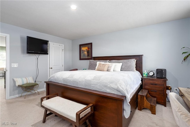 3939 Higgins Dr, Norton, OH 44203 - bedroom featuring baseboards and light carpet