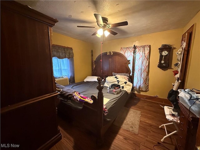 bedroom with ceiling fan and wood finished floors