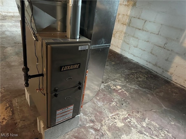 utility room with heating unit