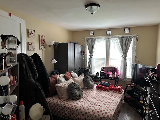 bedroom featuring wood finished floors