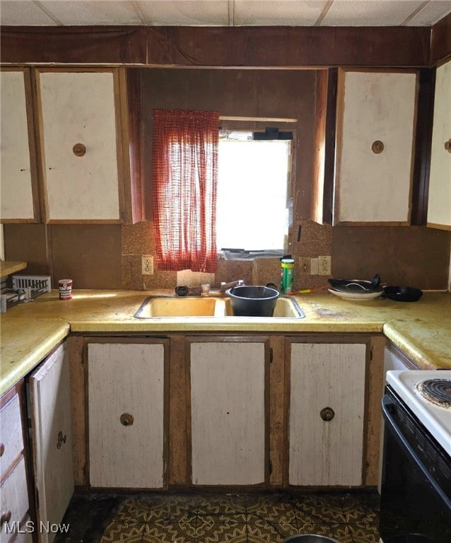 5961-5971 Streeter, Mantua, OH 44255 - kitchen featuring a sink, light countertops, and white range with electric cooktop