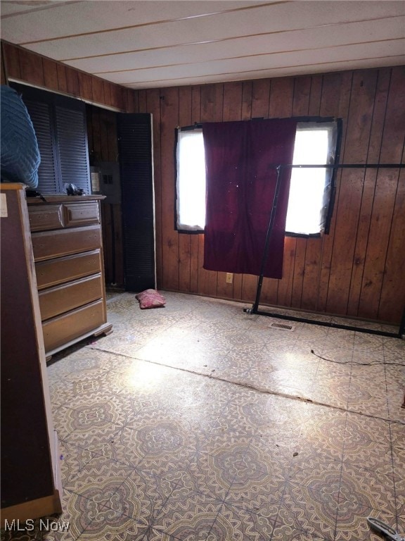 5961-5971 Streeter, Mantua, OH 44255 - unfurnished bedroom featuring wooden walls and visible vents