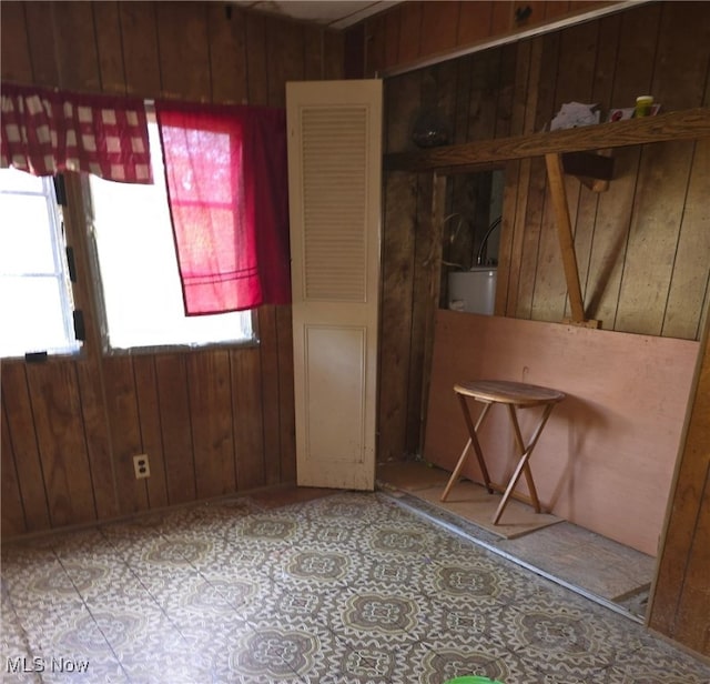 5961-5971 Streeter, Mantua, OH 44255 - unfurnished room featuring gas water heater and wood walls