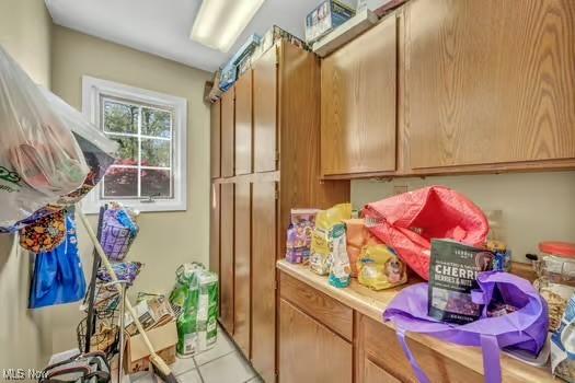 laundry room with light tile patterned floors
