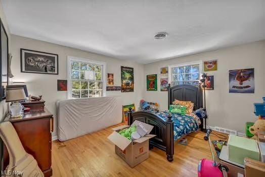 bedroom with wood finished floors