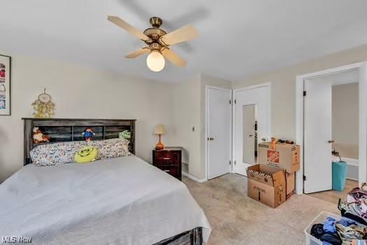 bedroom featuring a ceiling fan and carpet