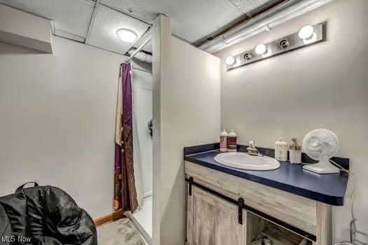 full bathroom featuring vanity and a shower stall