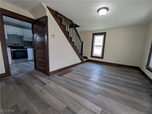 810 Pine St, Coshocton, OH 43812 - interior space with baseboards, stairs, and dark wood-type flooring