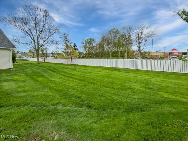 view of yard featuring fence