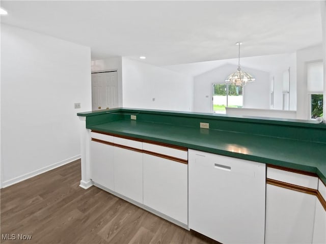 kitchen featuring dark countertops, wood finished floors, dishwasher, recessed lighting, and white cabinetry