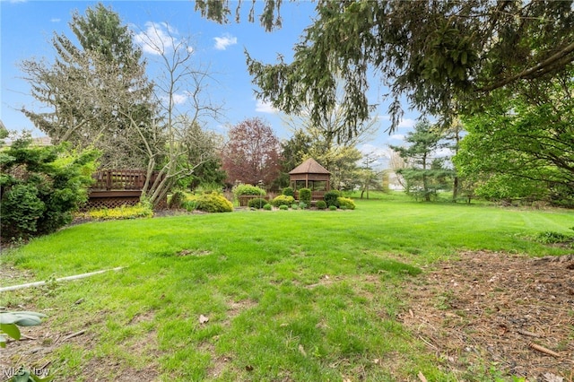 view of yard with a gazebo and a deck