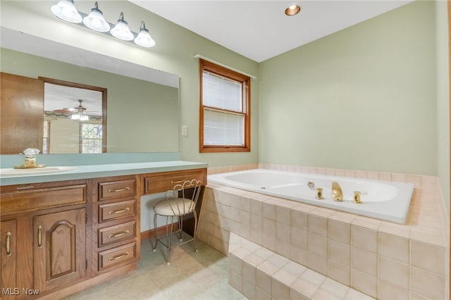 full bath featuring a garden tub and vanity
