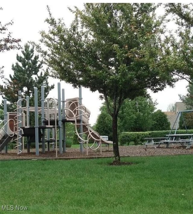 community play area featuring a lawn