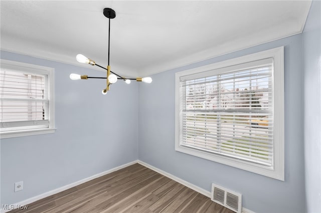 3811 Salisbury Rd, South Euclid, OH 44121 - spare room featuring visible vents, baseboards, plenty of natural light, and an inviting chandelier