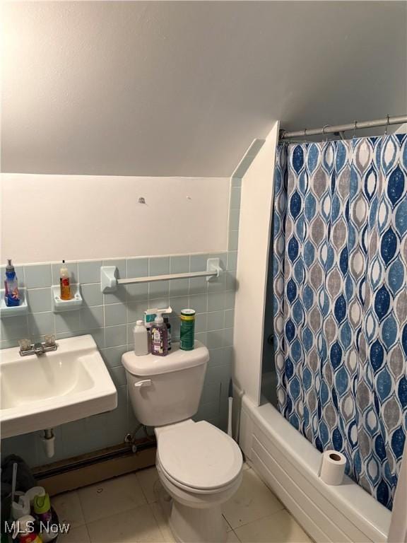 full bathroom featuring a sink, tile patterned floors, shower / bath combo, and toilet