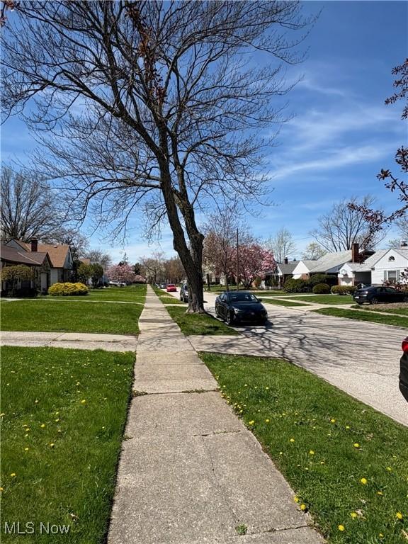 view of street featuring a residential view and sidewalks