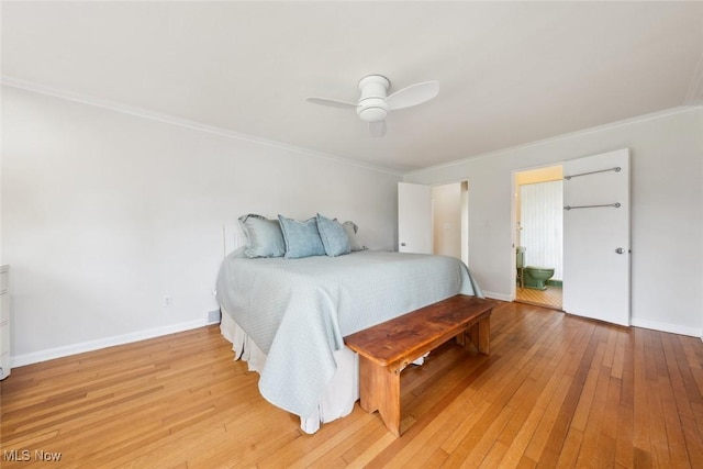 bedroom featuring crown molding, light wood-style flooring, ceiling fan, and baseboards