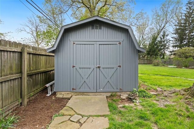 view of shed featuring a fenced backyard