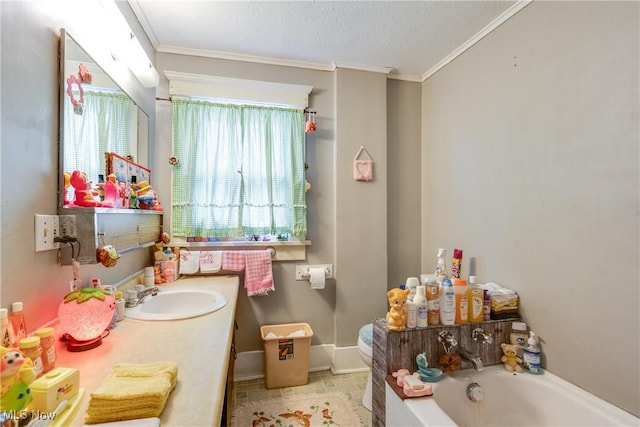 bathroom with a garden tub, crown molding, vanity, baseboards, and a textured ceiling