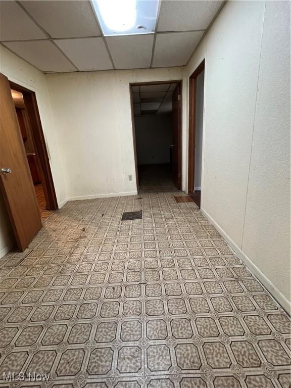 112 E College St, Alliance, OH 44601 - spare room with baseboards and a paneled ceiling