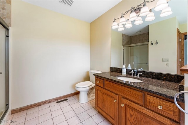 bathroom featuring visible vents, a stall shower, tile patterned floors, and vanity