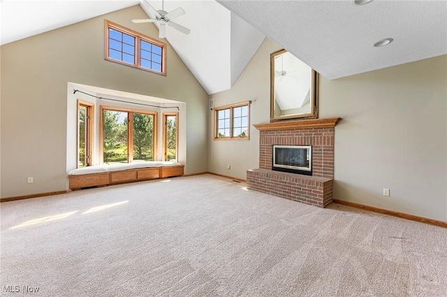 unfurnished living room with baseboards, a ceiling fan, and carpet