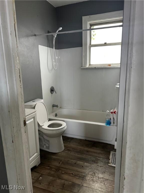 11413 Notre Dame Ave, Cleveland, OH 44104 - bathroom featuring toilet, bathing tub / shower combination, wood finished floors, and vanity