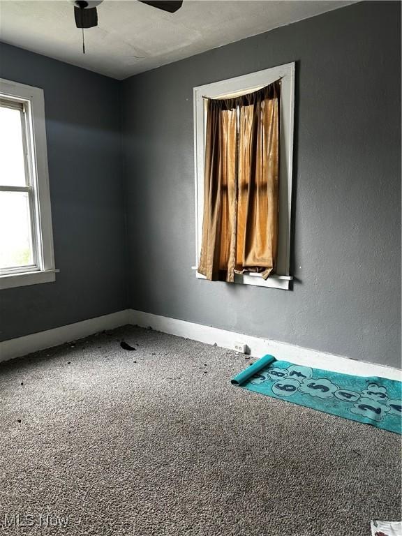 11413 Notre Dame Ave, Cleveland, OH 44104 - carpeted spare room with baseboards and ceiling fan