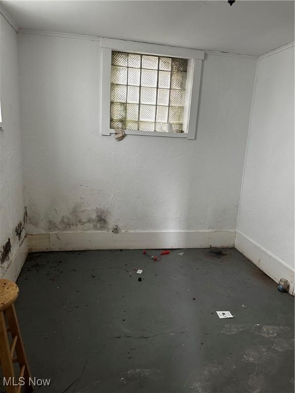 11413 Notre Dame Ave, Cleveland, OH 44104 - unfurnished room featuring baseboards and concrete floors