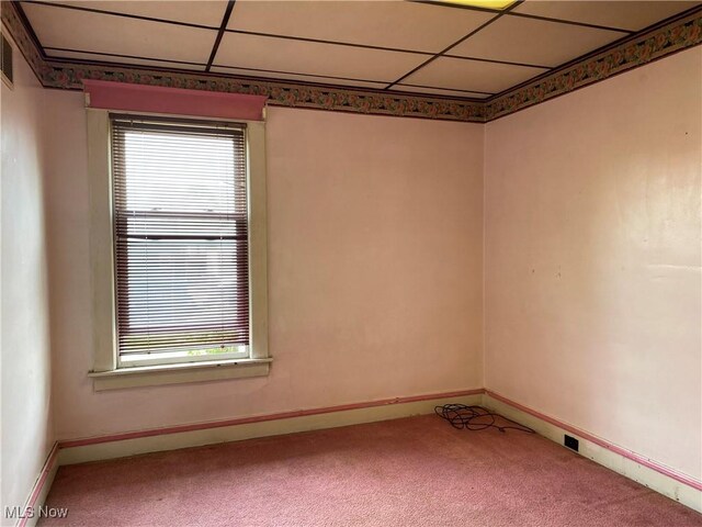 carpeted empty room with baseboards and a healthy amount of sunlight