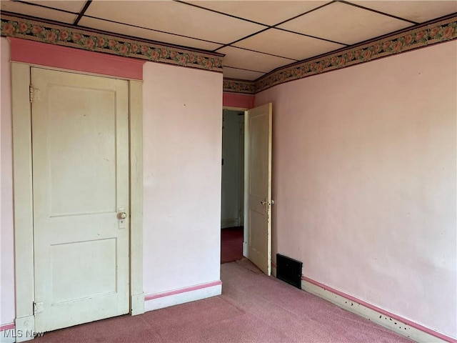 unfurnished bedroom with light colored carpet