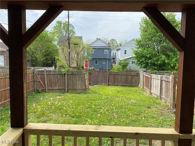 view of yard with a residential view and a fenced backyard