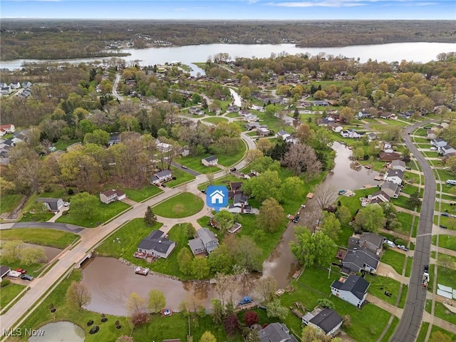 bird's eye view with a residential view and a water view