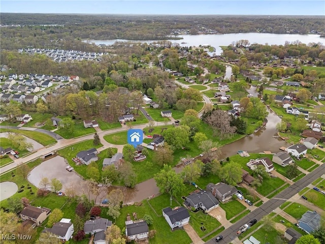bird's eye view featuring a water view and a residential view