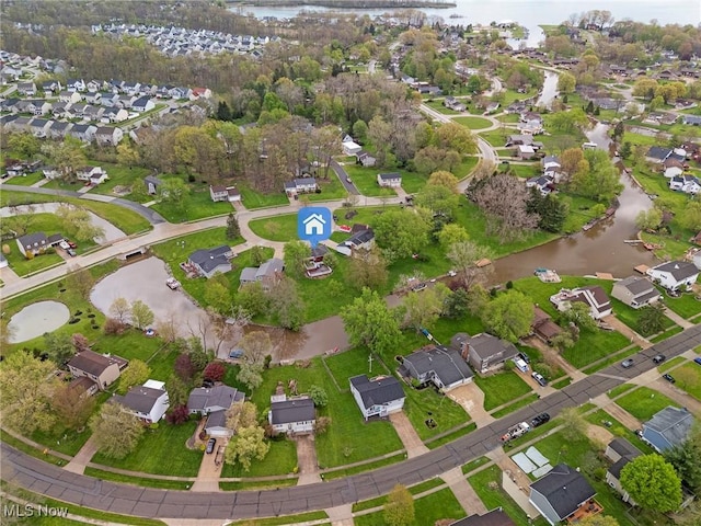 bird's eye view featuring a residential view and a water view
