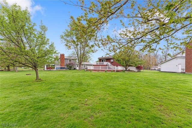 view of yard with a wooden deck